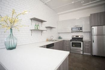 Fully equipped kitchen with black or stainless appliance package